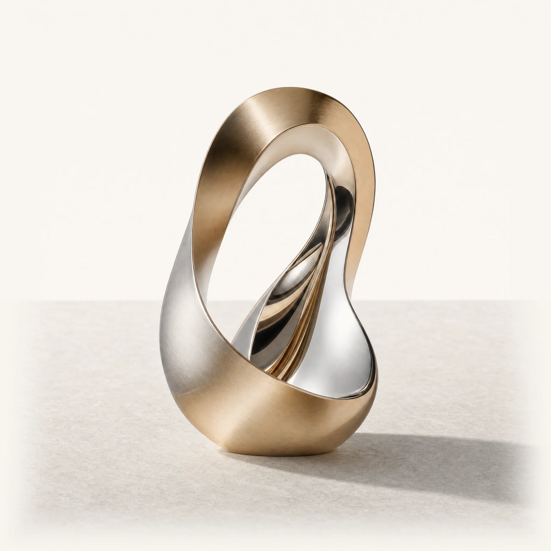 Orileva Luminous collection – metal element journal series, sculptural champagne-gold metal form