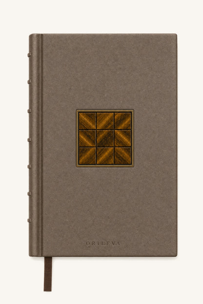 The Grounded Journal — olive nubuck cover with a nine-square tiger's eye inlay