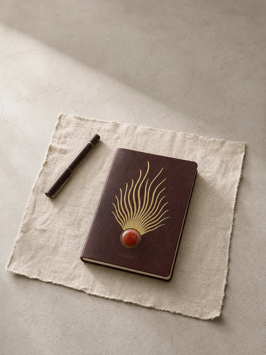 An Orileva leather journal with a natural stone inlay