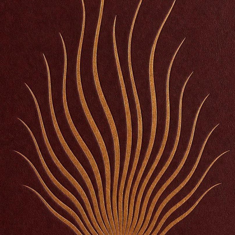 Full-grain leather, natural red jasper inlay, and hand-finished binding on The Ember Journal